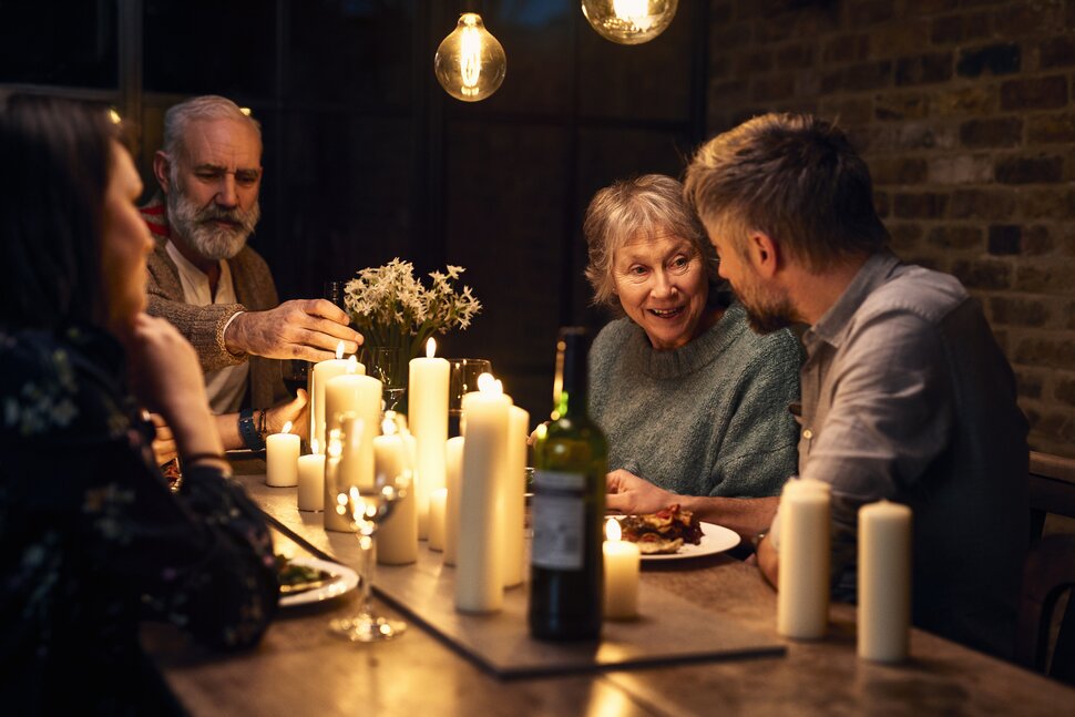 Parents and grown children having a meal